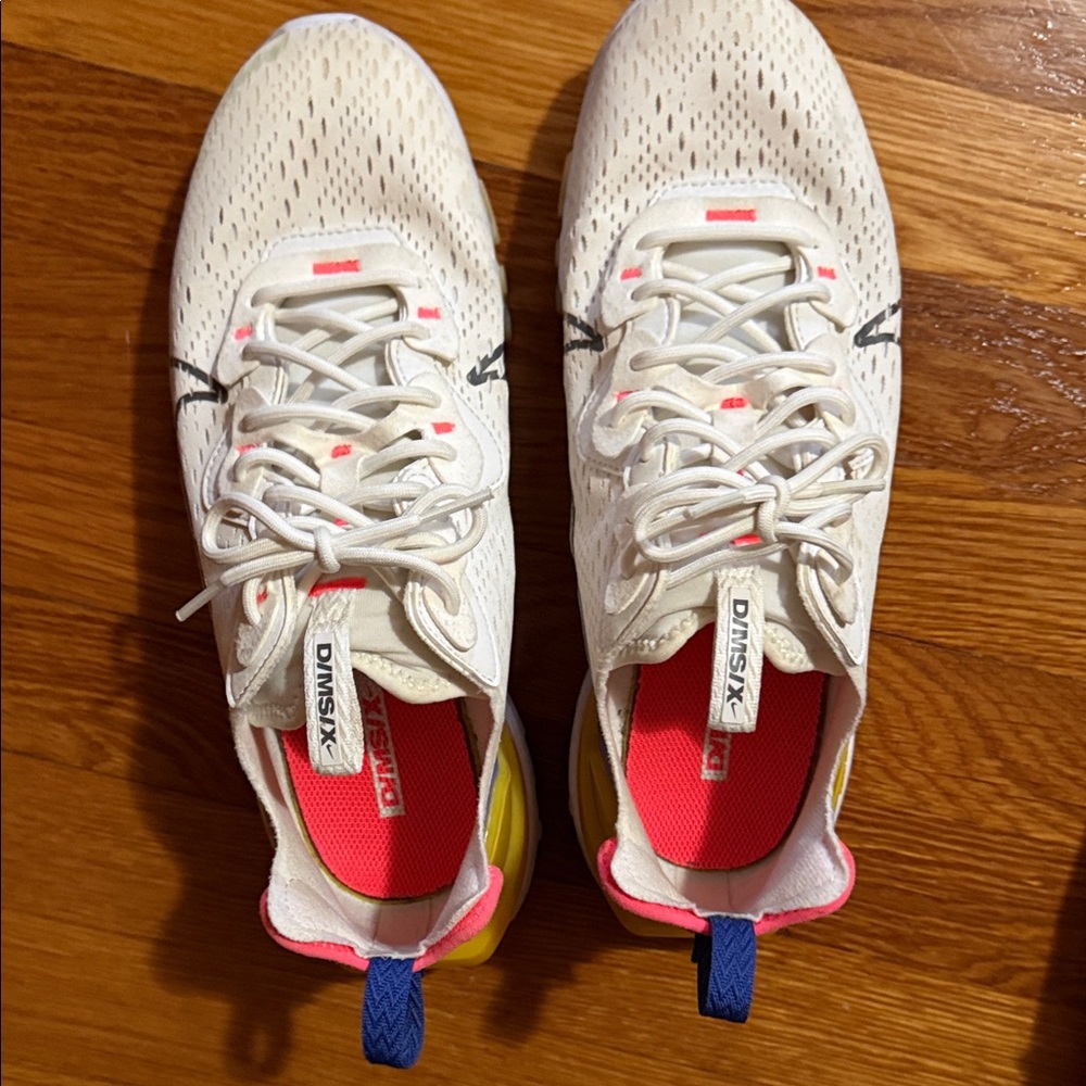Nike Women's White Sneakers with Pink and Yellow Accents